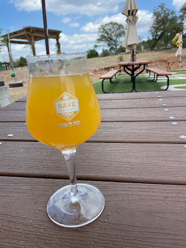 Save The World Brewing Co exterior view showcasing professional Brewery services in Marble Falls, Texas