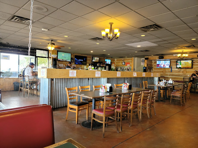 Slaughterhouse: What the Hell Bar & Grill exterior view showcasing professional restaurants services in Mesa, Arizona