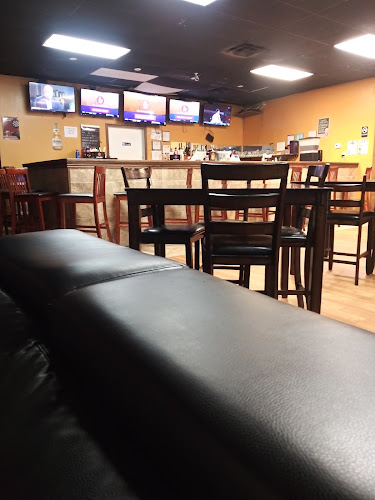 THE HONEYCOMB SPORTS BAR & GRILL exterior view showcasing professional restaurants services in Phenix City, Alabama